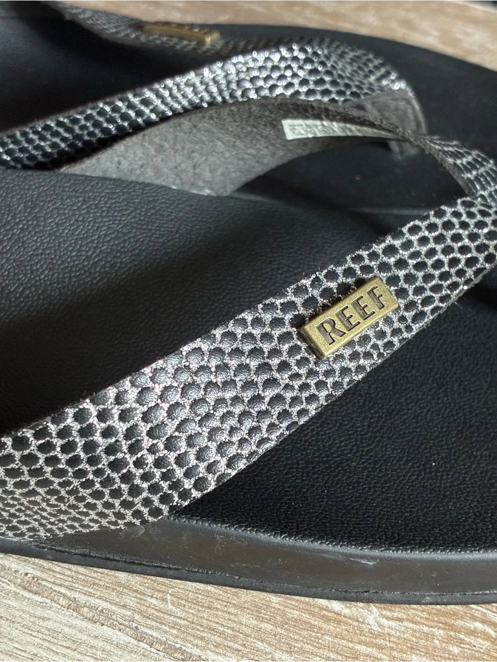 Reef Black Cushion Court Flip Flops with Snakeskin-Pattern Straps and Gold Logo